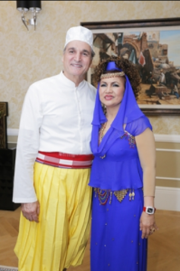 Robert and Raziah - a couple who love to dress up for their expensive parties