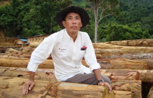 Numpang Suntai and illegally felled logs from his community lands in Sebangan