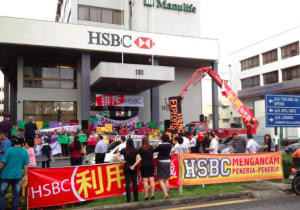 Sacked workers protest outside HSBC's abandoned offices in Kuching.