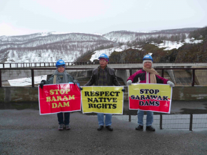 SAVE Rivers protest on top of the Alta Kraftverk Dam at the Alter River in Finmark, Northern Norway