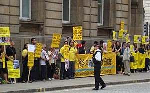 Police monitoring the Bersih marchers in London - and protecting them from the traffic!