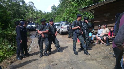 Armed police guard the logging teams from MM Golden over a tense weekend