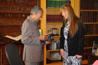 Prepared to change policy - Dr Mahathir accepts a copy of the book that exposes timber corruption in Sarawak