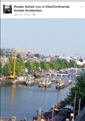 Roslan takes a photo from the luxurious Intercontinental Hotel in Amsterdam