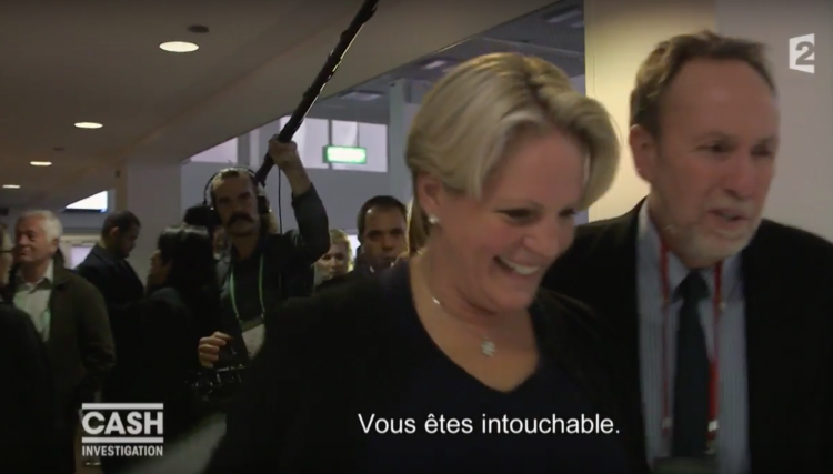 "Don't worry - you are untouchable"! Khadem Al Qubaisi's banker Arriane de Rothschild is comforted by a companion after being questioned by journalists. She plainly agrees that she and all her fellow bankers are!