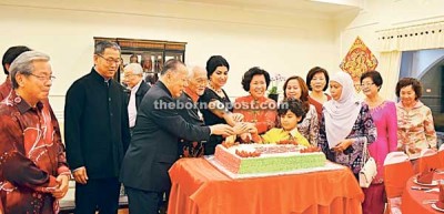 Taib and Samling's boss Yaw Tech Seng (left) together cut the New Year cake