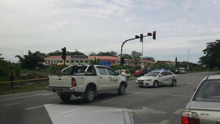 A violent campaign which ended in murder at this traffic light in Miri - and with the powerful main suspect on the run