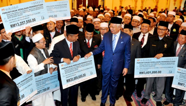 Kind and generous Najib is handing out public money in return for votes again