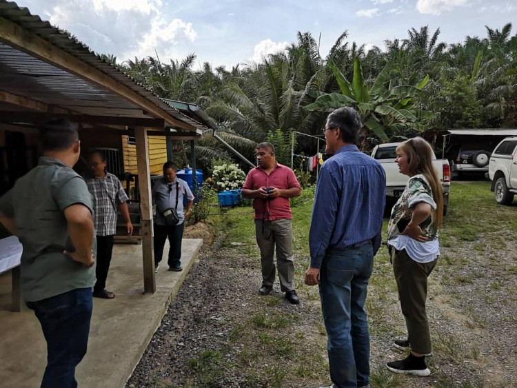 Explaining the initiative to a local community leader in Sabah